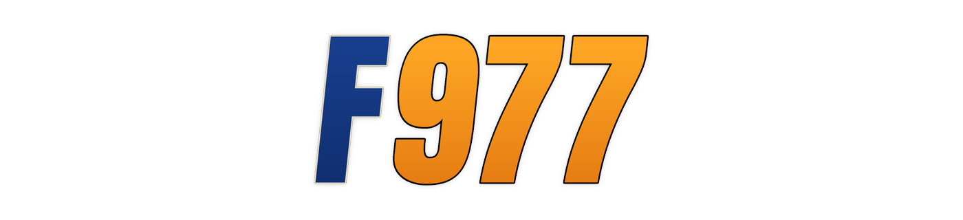 f977